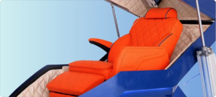 A photo of the Apex hyperbaric oxygen therapy (HBOT) chamber, open to show its reclining seat and cushioned interiors good for one person.